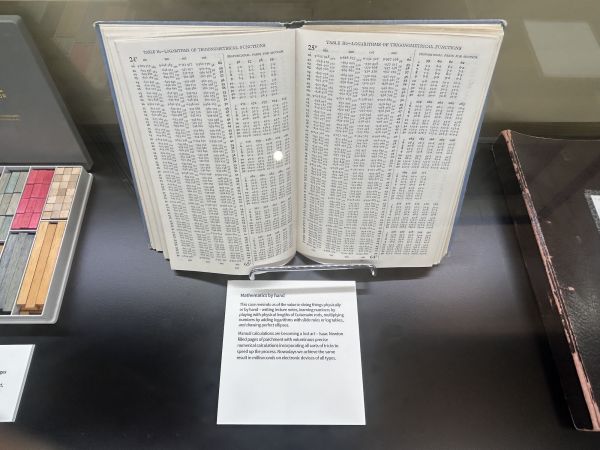 A book displaying two pages of logarithms