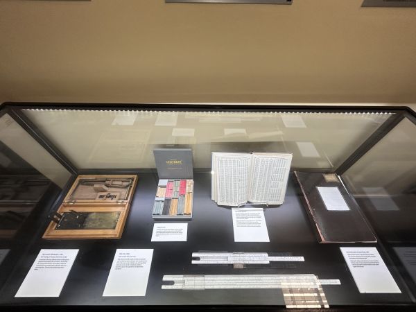 Display case showing a range of instruments and books